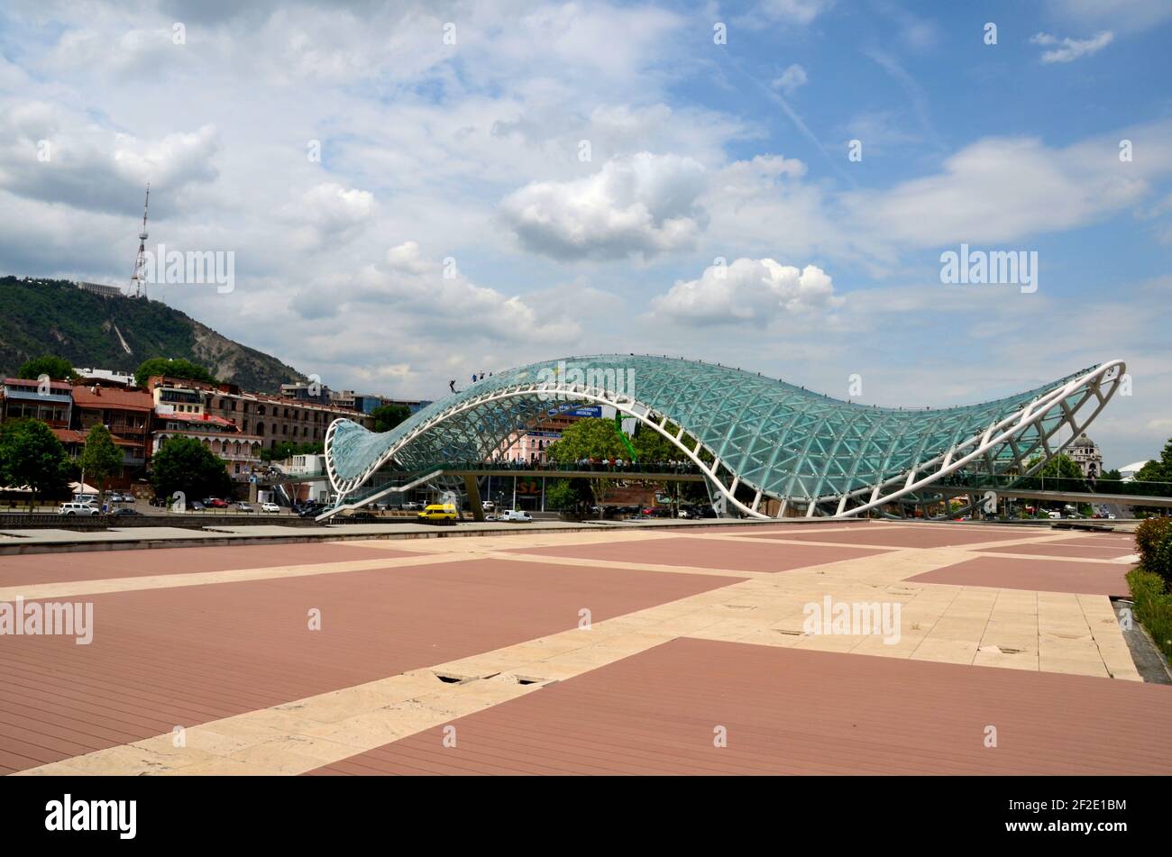 Glass canopy over pedestrian Bridge of Peace over Kura River Tbilisi Georgia Stock Photo