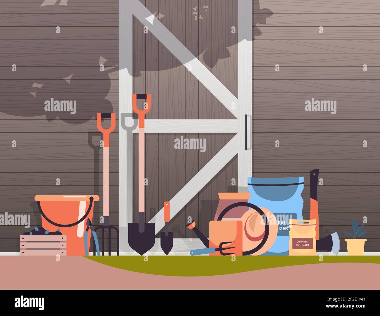 different garden and farm tools gardening equipment near wooden barn