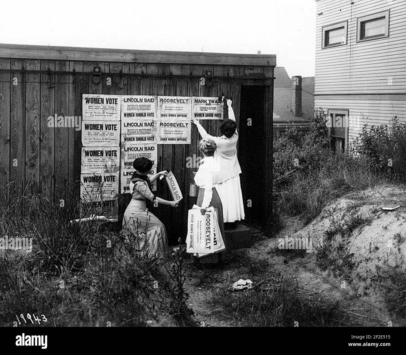 Posting signs to promote woman suffrage, Washington Equal Suffrage Association, Seattle, 1910 Stock Photo