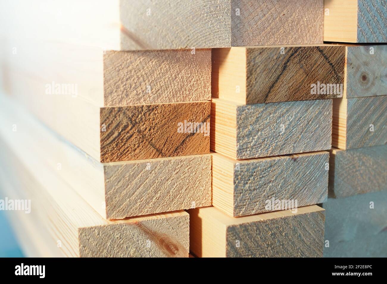 Clean wooden blocks are stacked. Industrial background for advertising building materials. Stock Photo