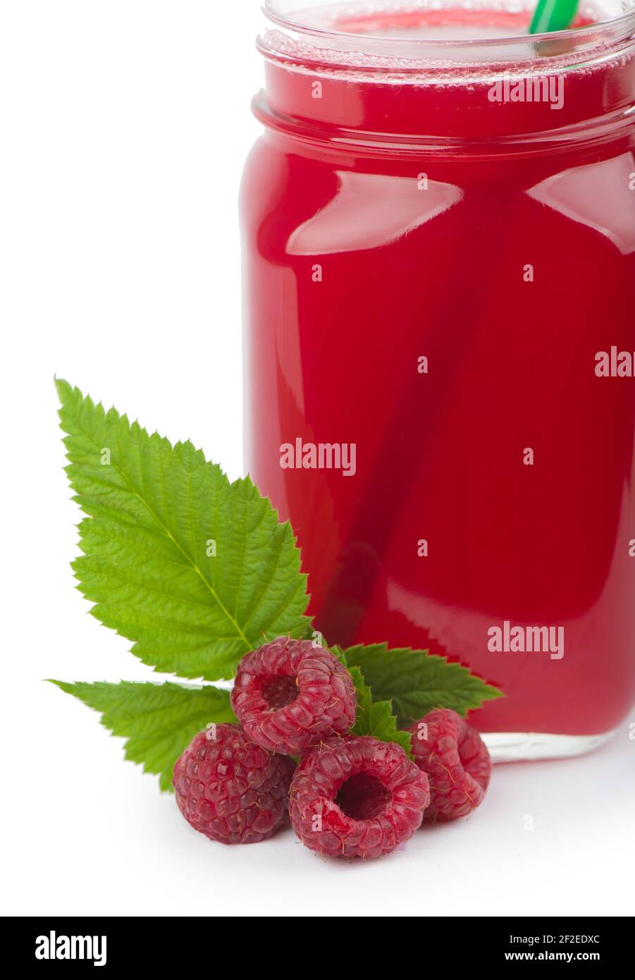 Dejuiced Raspberry the raspberries and juice isolated on white Stock Photo - Alamy
