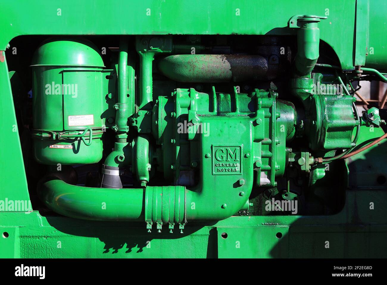 A bright green General Motors tractor engine. Stock Photo