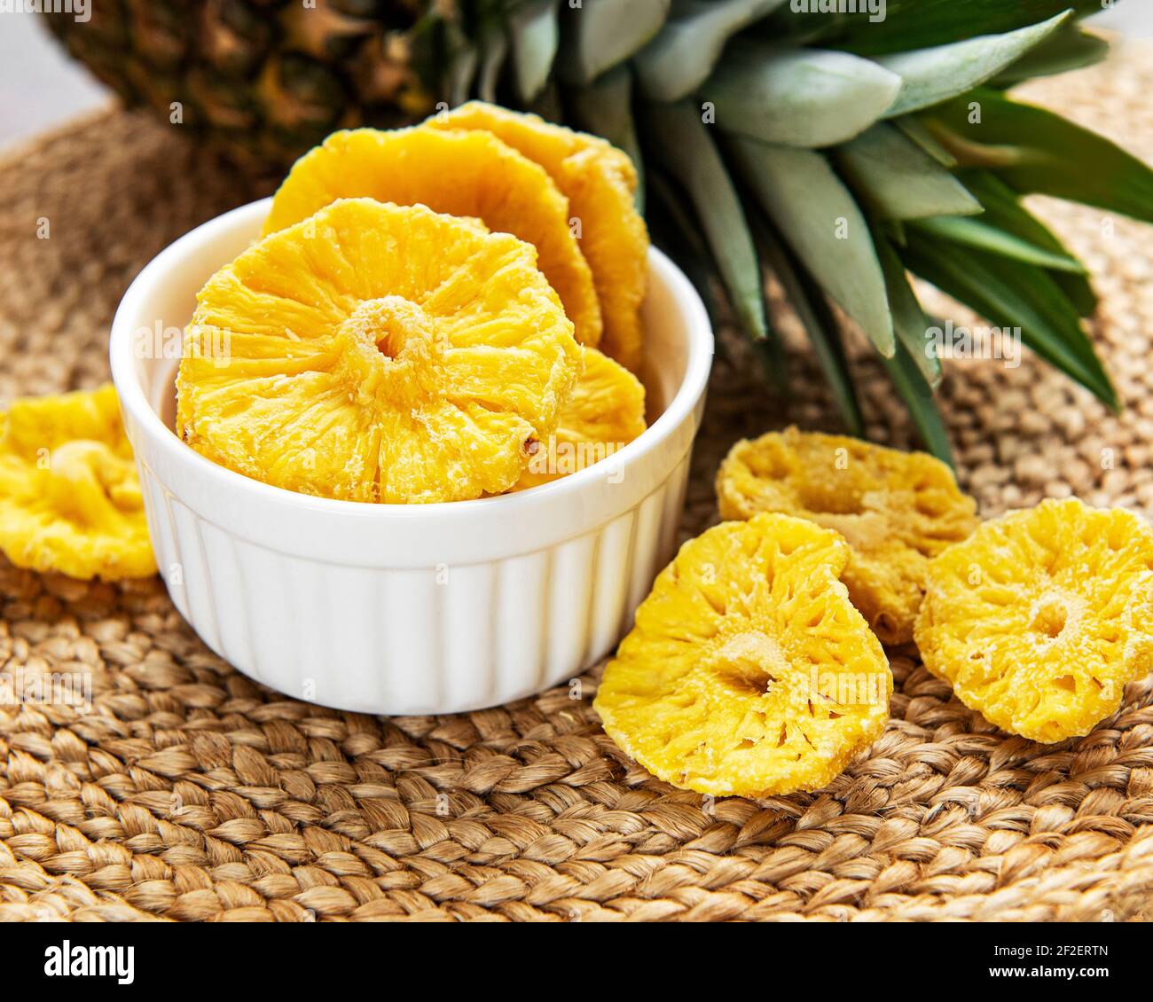 Pineapple dried rings on a rustic background Stock Photo