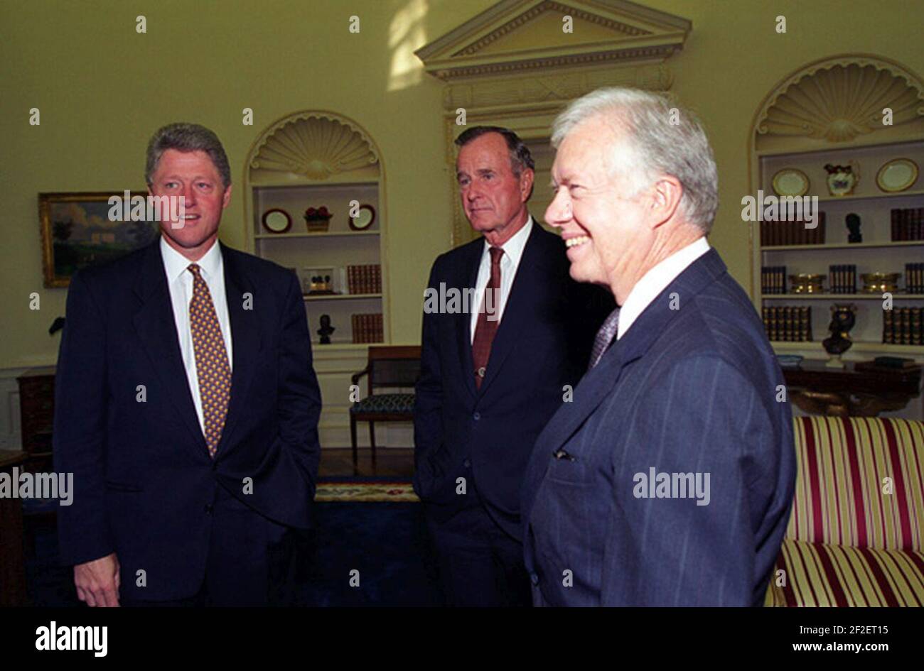 President Bill Clinton meeting with former Presidents George H.W. Bush and Jimmy Carter at the White House. Stock Photo