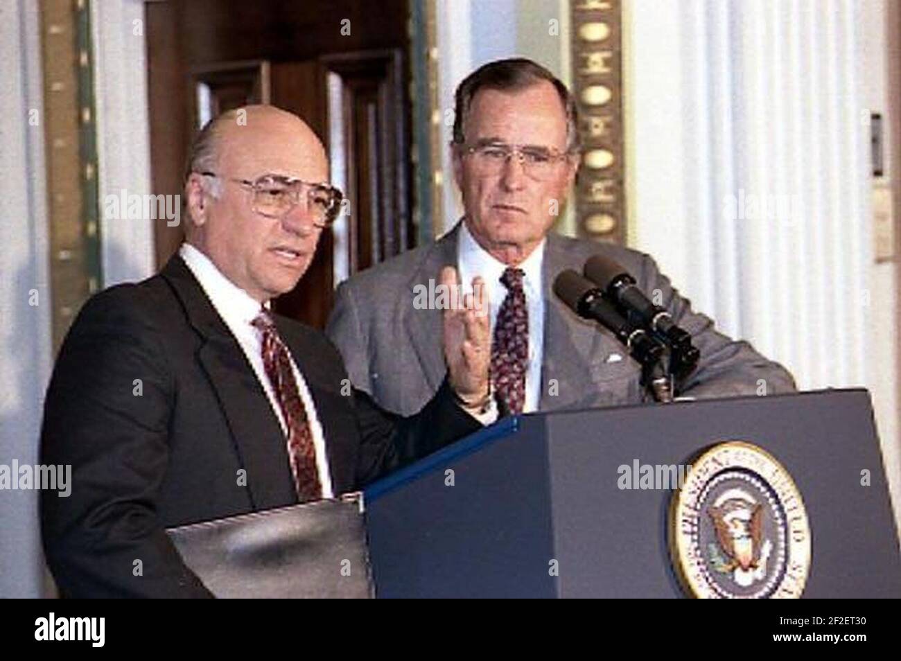 President Bush shares the podium with Secretary Yeutter at a briefing of the National Association of Agricultural Journalists in the Indian Treaty Room of the White House. Stock Photo