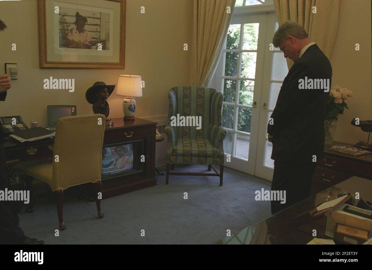 President Bill Clinton watching coverage of the Oklahoma City bombing