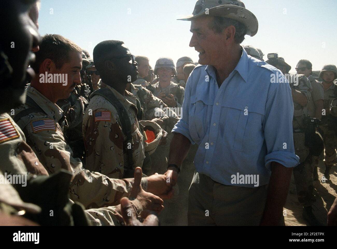 President George H. W. Bush meets soldiers of the 197th Brigade, 24th Infantry Division. Stock Photo