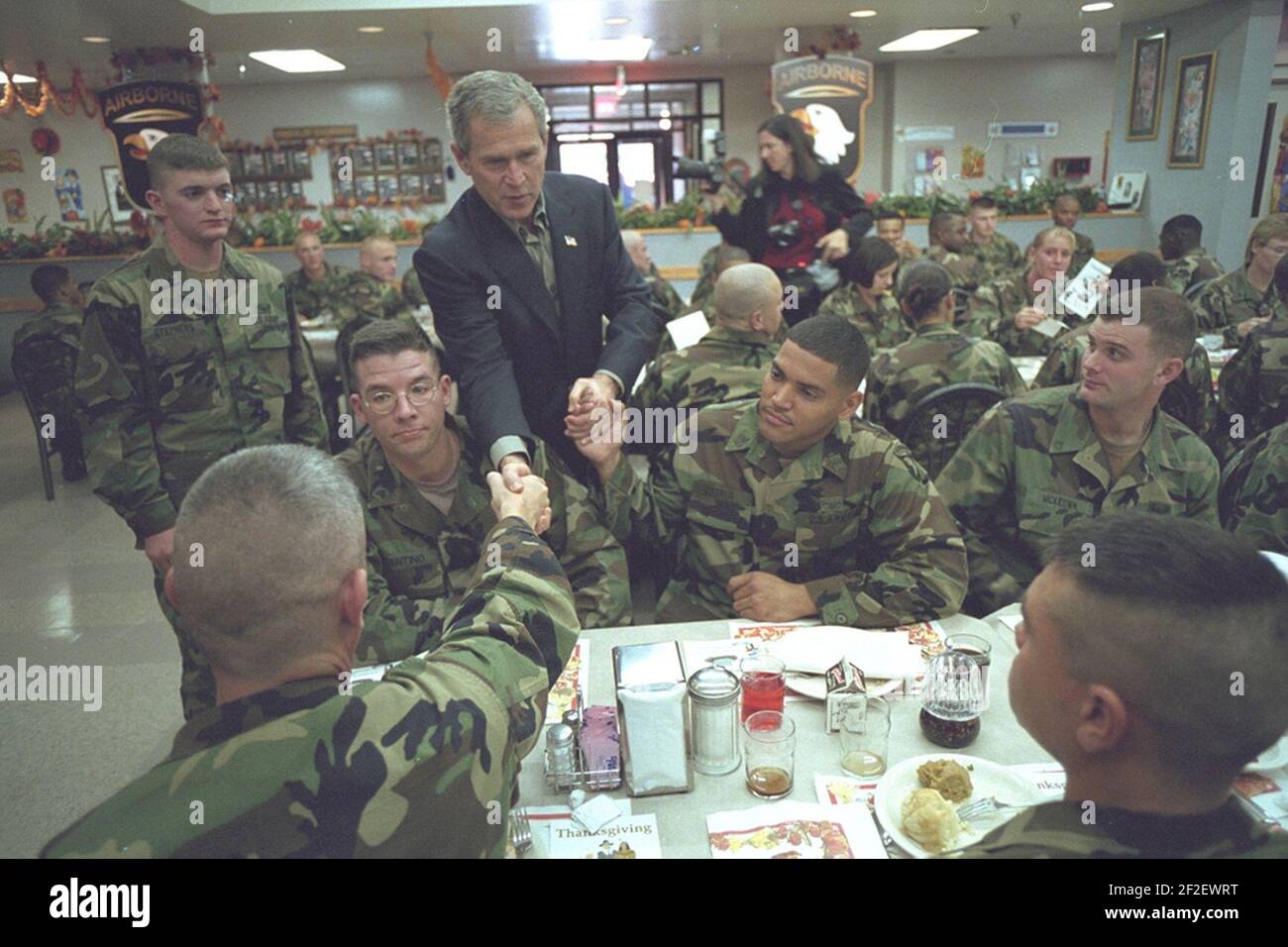 President George W. Bush Shakes Hands with Soldiers During a Thanksgiving Meal at Fort Campbell, Kentucky. Stock Photo