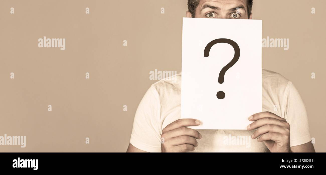 Anonymous man, peeking behind of interrogation symbol. Male incognita ...