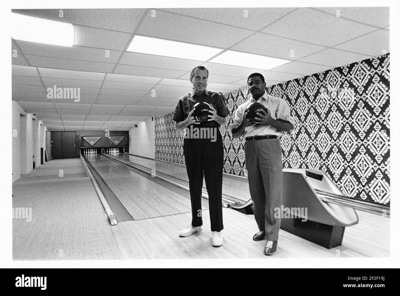 President Richard Nixon bowling with Frank Blair in the White House bowling alley. Stock Photo