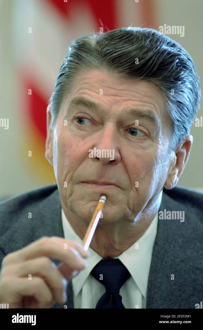 President Ronald Reagan during a meeting with members of Congress in the  Cabinet Room Stock Photo