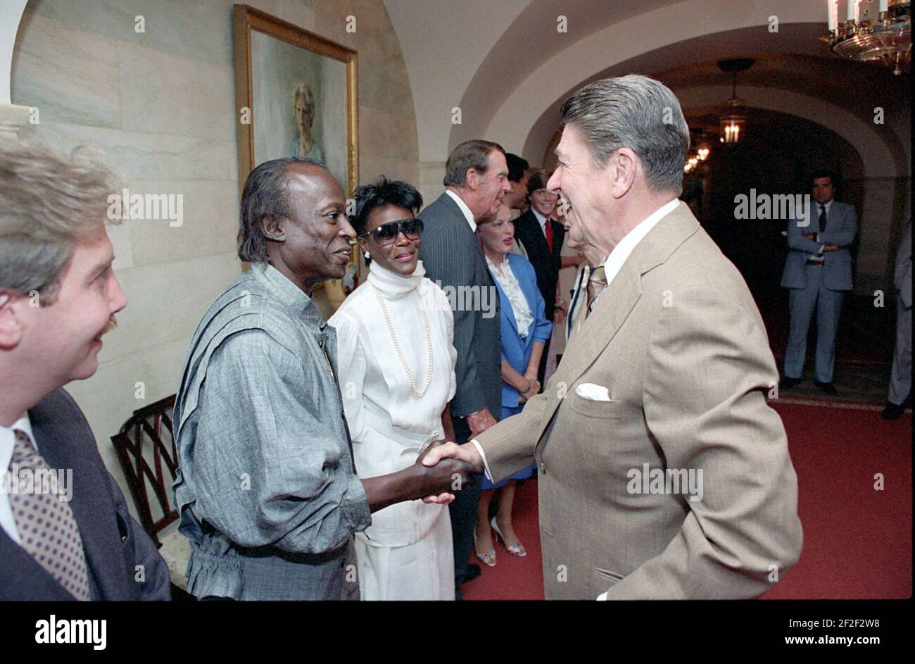 President Ronald Reagan greeting Miles Davis and Cicely Tyson. Stock Photo