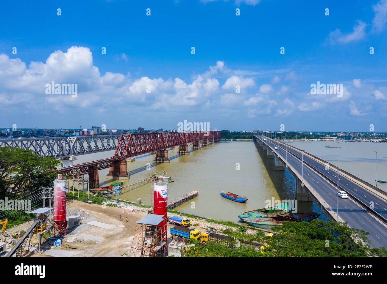 Aerial photo of Syed Nazrul Islam Bridge and two rail way bridges cross the Meghna River from Bhairab Bazar to Ashuganj. Bangladesh. Stock Photo