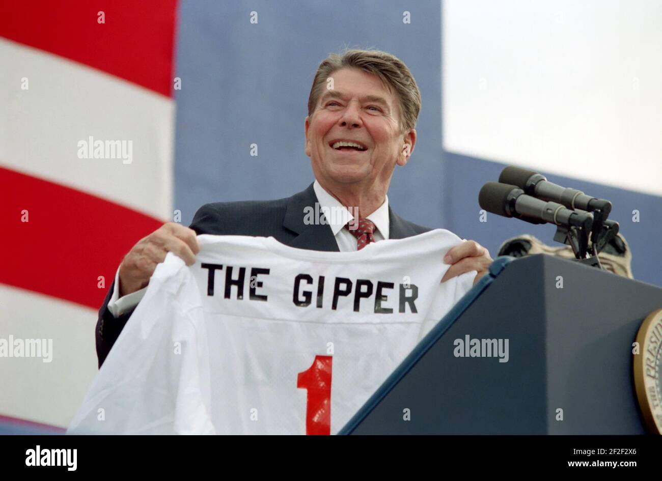 President Ronald Reagan holding ''The Gipper'' jersey at a campaign rally in Endicott, New York. Stock Photo