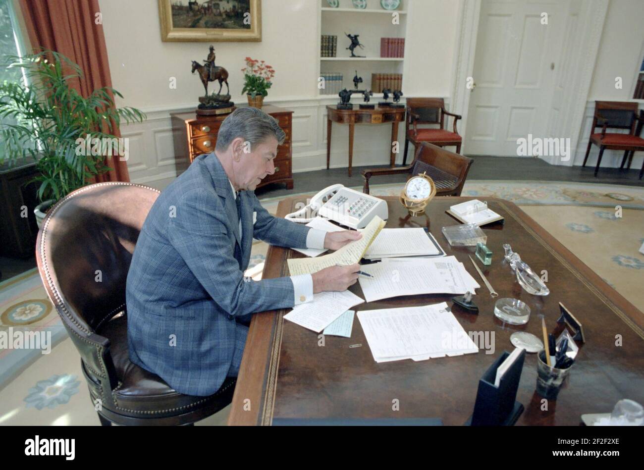 President Ronald Reagan in the Oval Office Working on an Upcoming ...