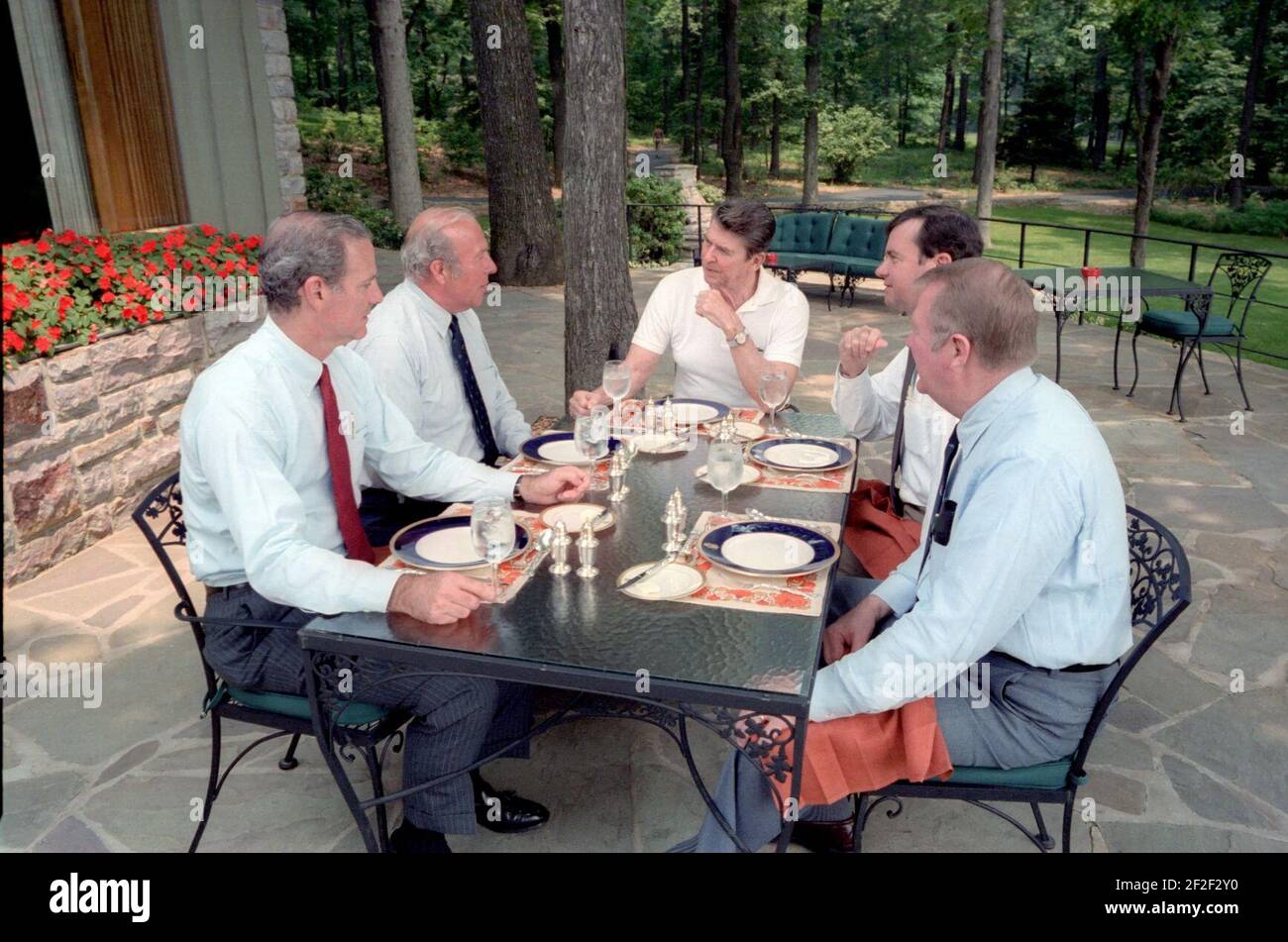 President Ronald Reagan having a luncheon meeting at Camp David Stock ...