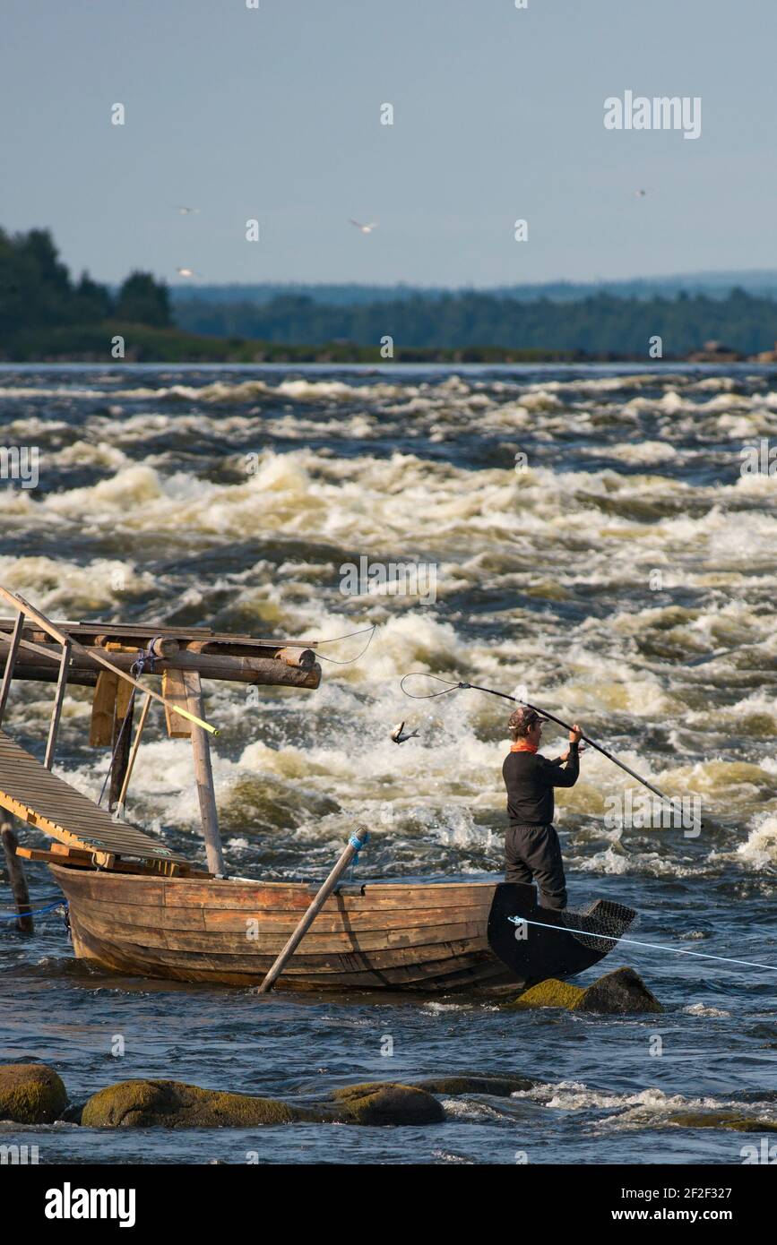 Fishing in Kukkola River between Sweden And Finland Stock Photo