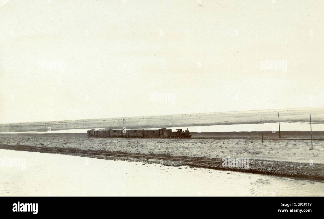 Pre-WWI photo of an Egyptian Delta Light Railways, close to the Suez Canal, with a Krauss 2-4-0 steam locomotive. Stock Photo