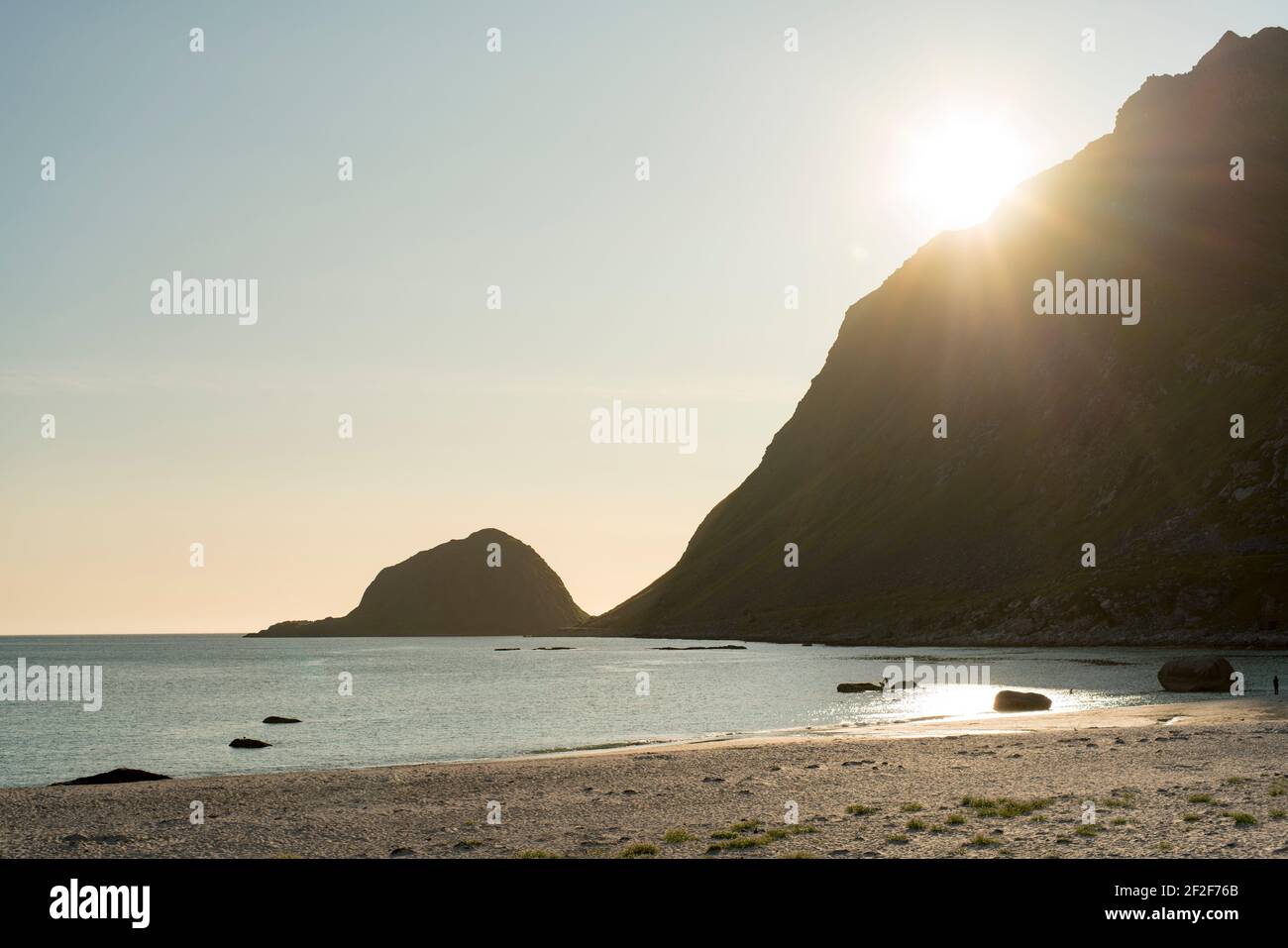 Summer beach with setting sun at Haukland Beach Lofoten Islands Stock ...