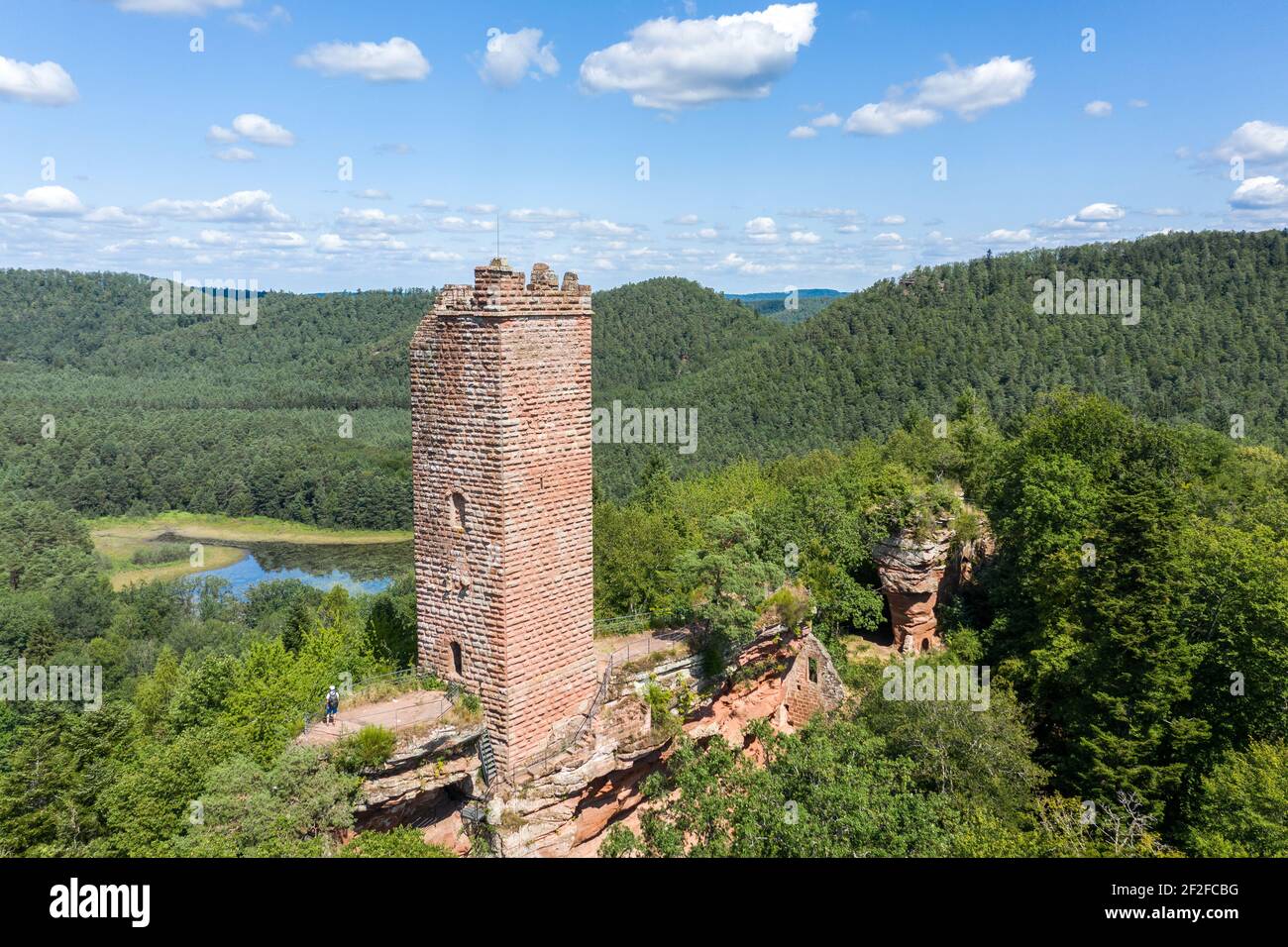 Aerial view of Waldeck castle, Moselle, France. Square red brick tower