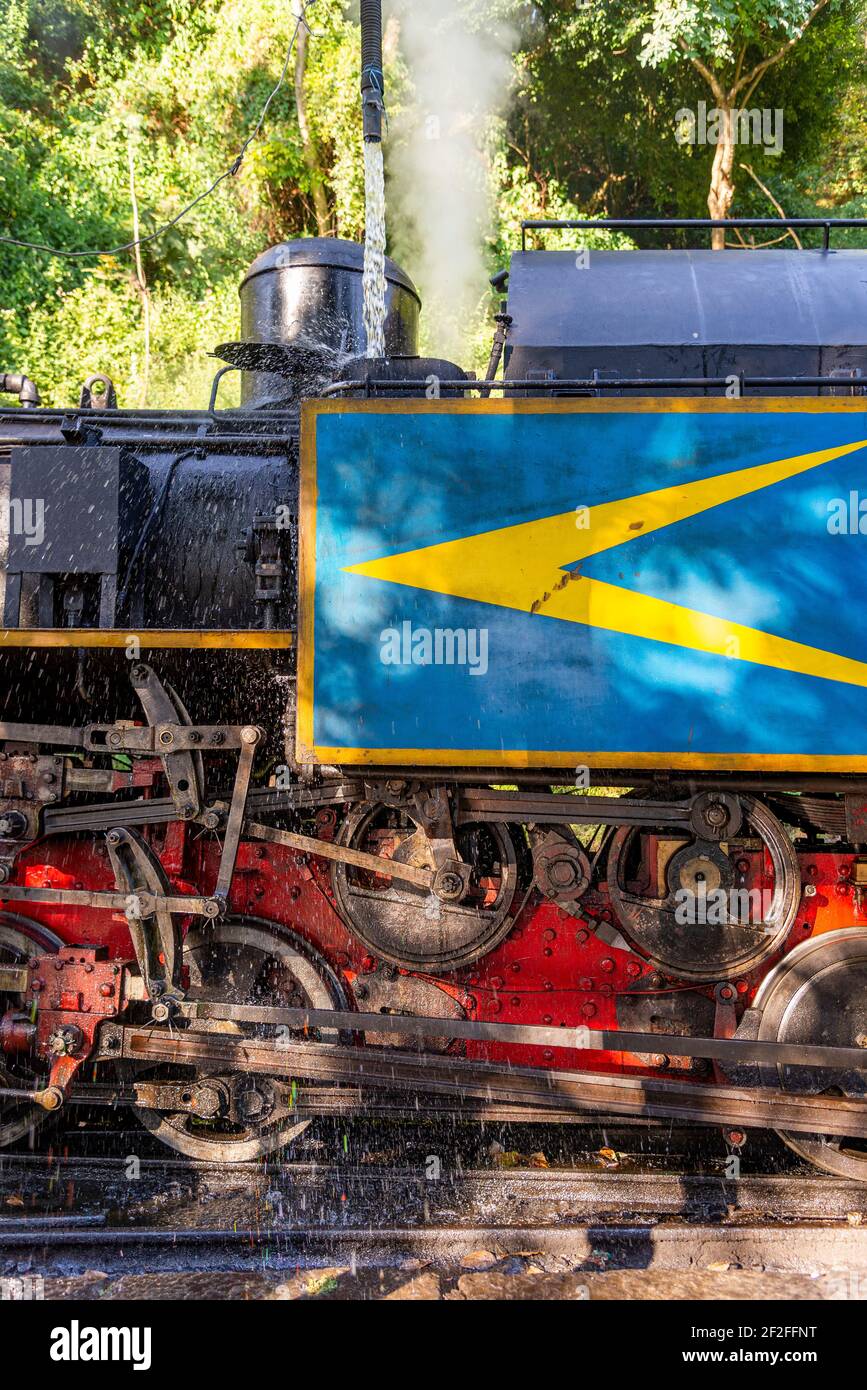 Filling the water tanks of the locomotive of the Blue Mountain Train, Tamil Nadu, India Stock Photo