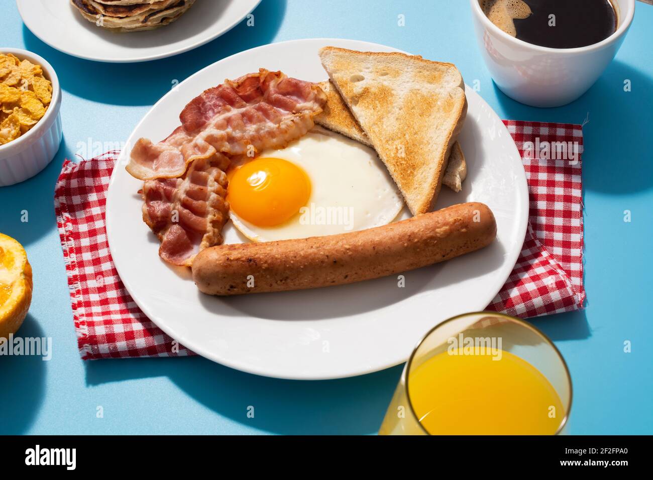Traditional American breakfast on blue background Stock Photo