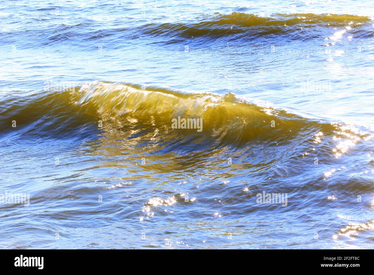 Sunny Reflection The reflection of light at a wave of the sea a bright Sunny day Stock ...