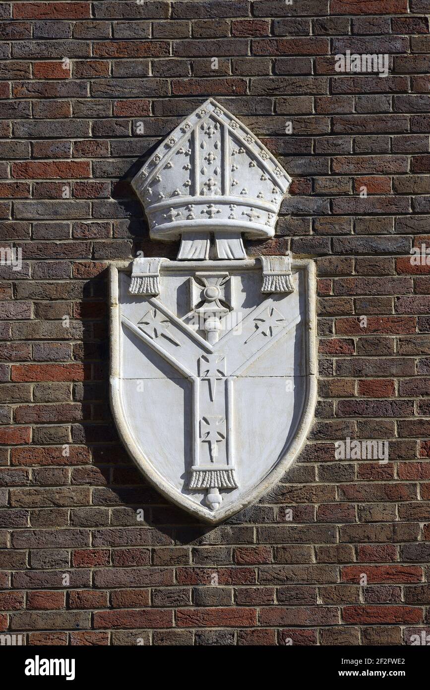 London, England, UK. Church House, Westminster. Coat of Arms of the Archbishop of Canterbury on the wall in Great Smith Street Stock Photo