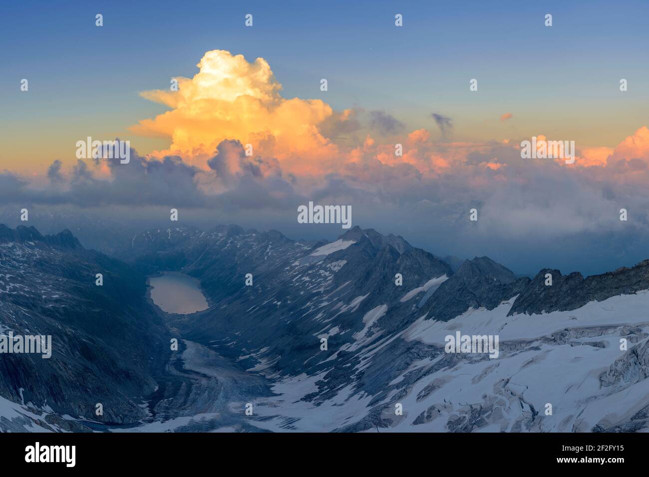 geography / travel, Switzerland, Valais, Lake Oberaarsee seen from Oberaarhorn summit, under the sunse, Additional-Rights-Clearance-Info-Not-Available Stock Photo