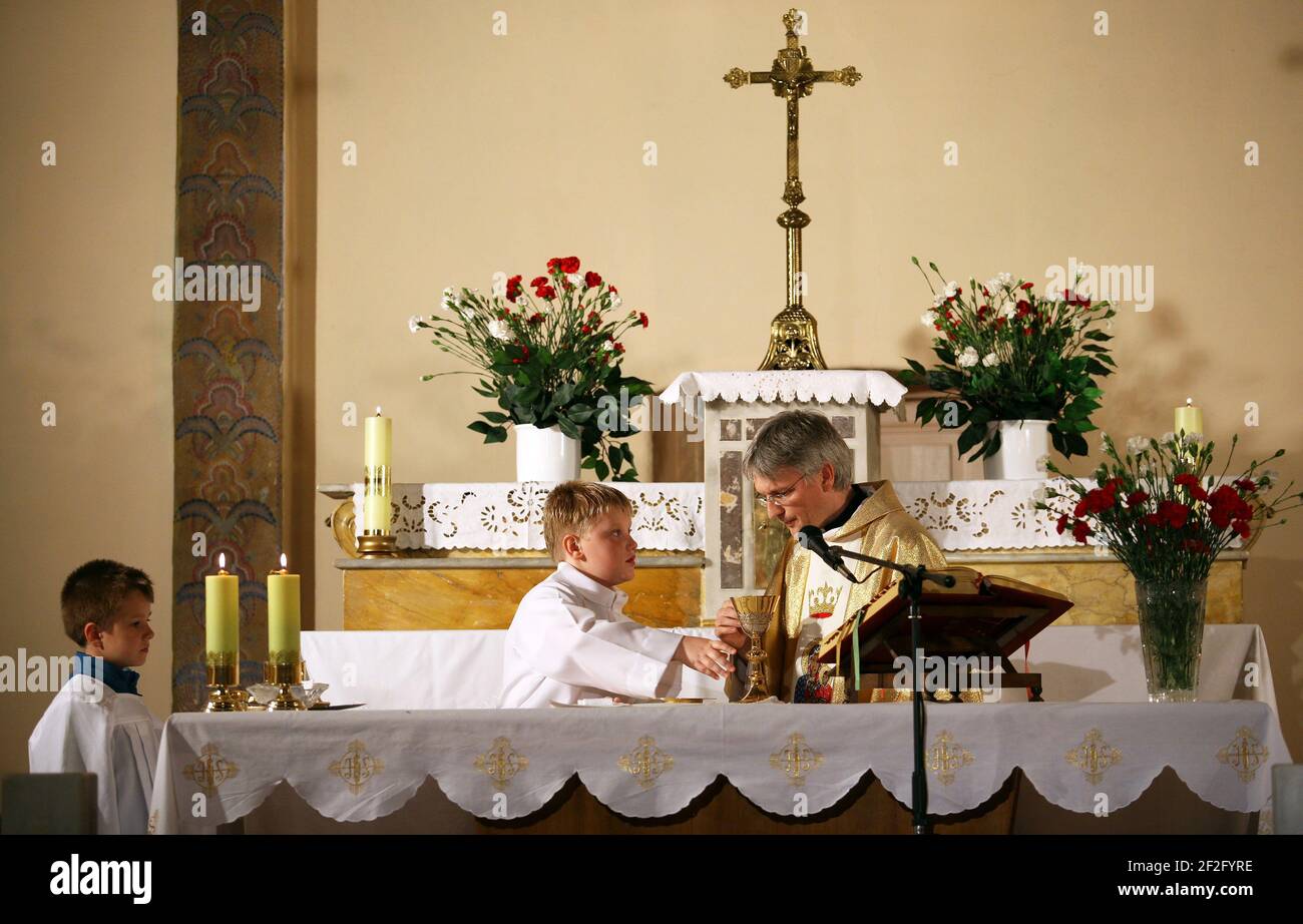 ISTANBUL, TURKEY - MAY 2: Priest, praying to God consecration the bread and wine in Czestochowa's Mother Mary Church on May 2, 2009 in Polenezkoy, Istanbul, Turkey. Stock Photo