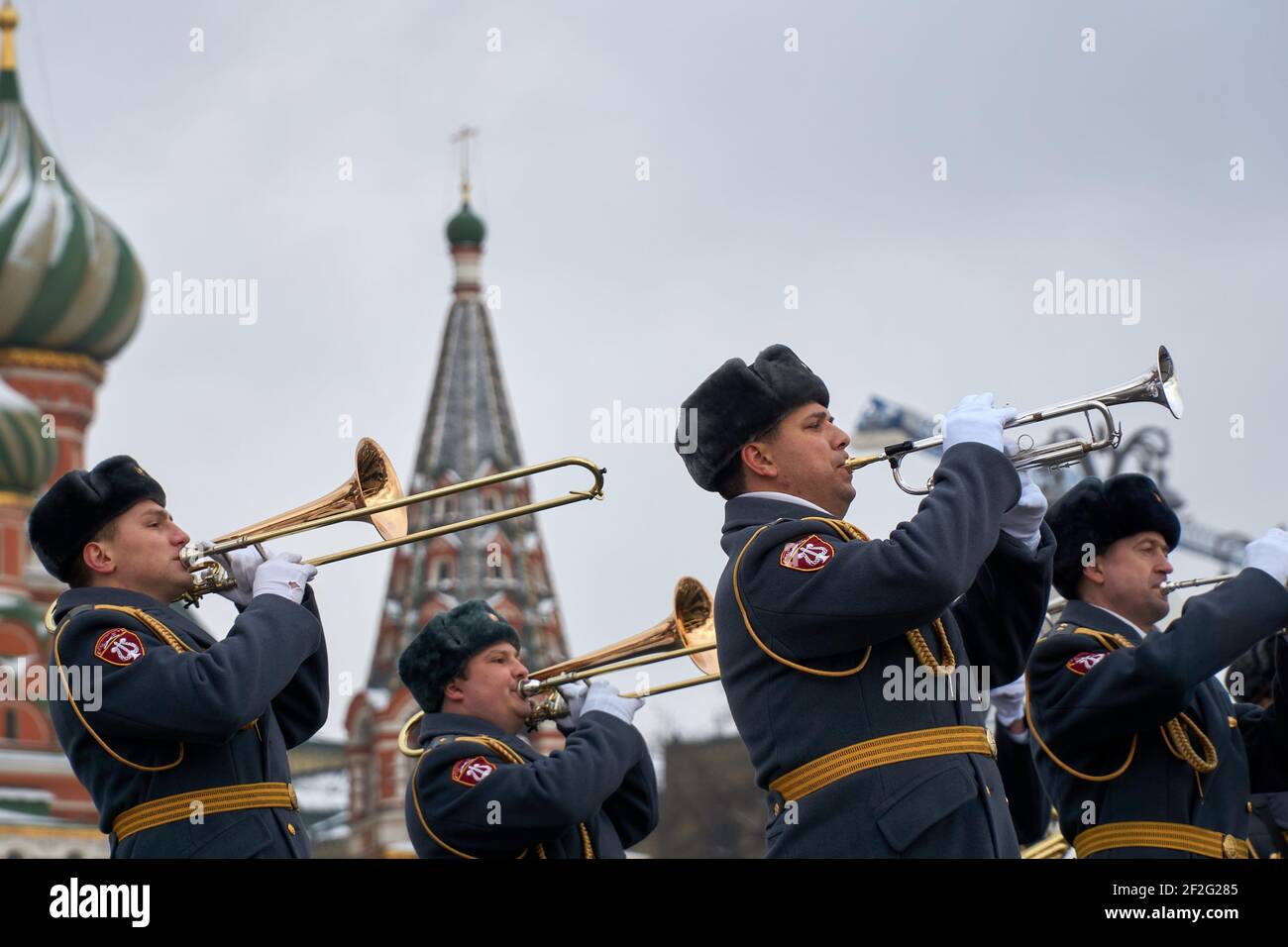 Military Musicians With Trombones And Trumpets Perform With The  Intercession Cathedral Of The Moscow Kremlin In The Background During  Rehearsals Ahead Of The Festival.every Year Military Bands Take Part In The  Spasskaya