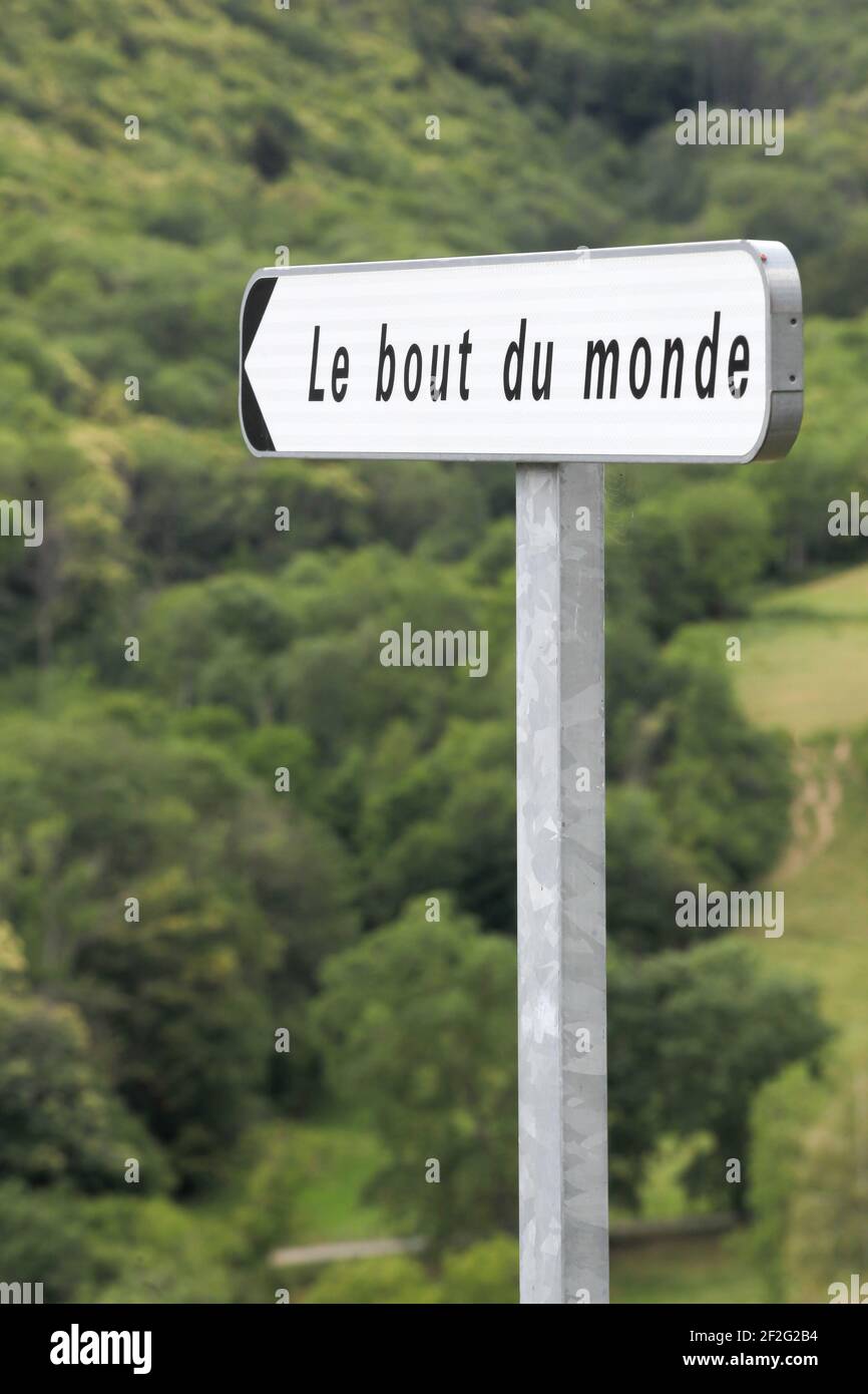 Road sign the end of the world called le bout du monde in french language Stock Photo