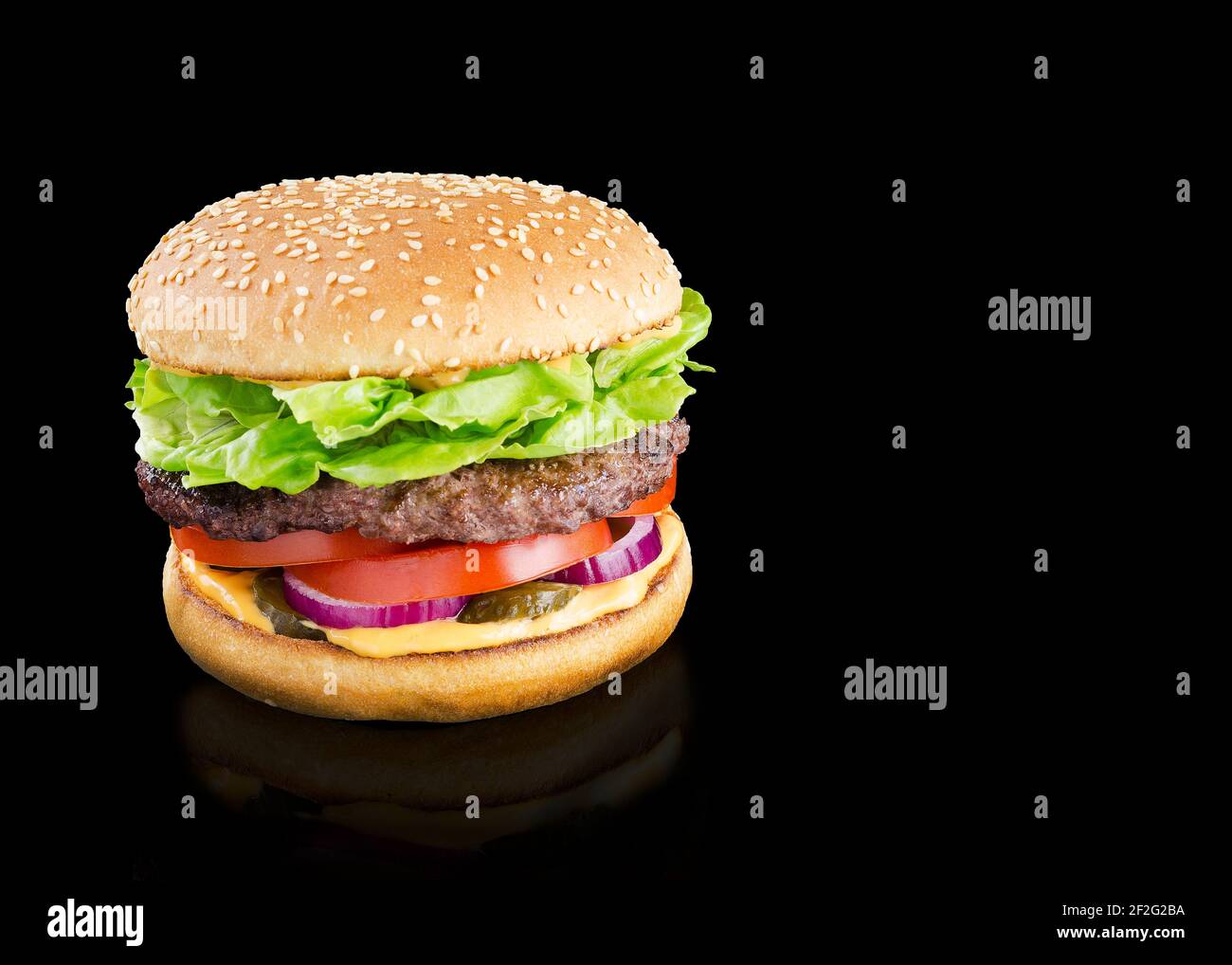 appetizing burger on a black background Stock Photo