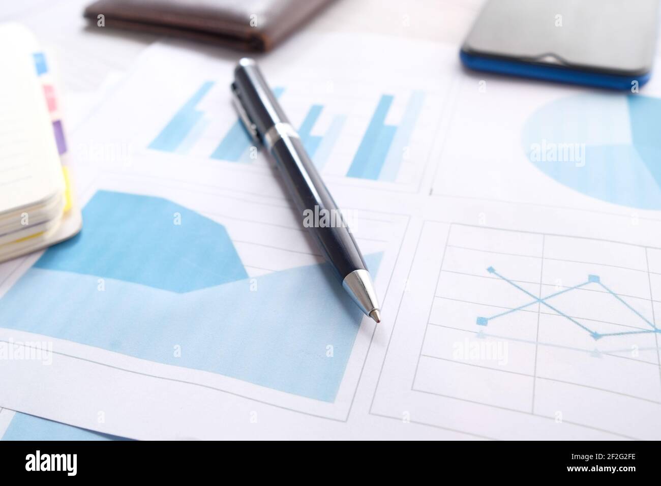 financial graph, calculator and notepad on table  Stock Photo
