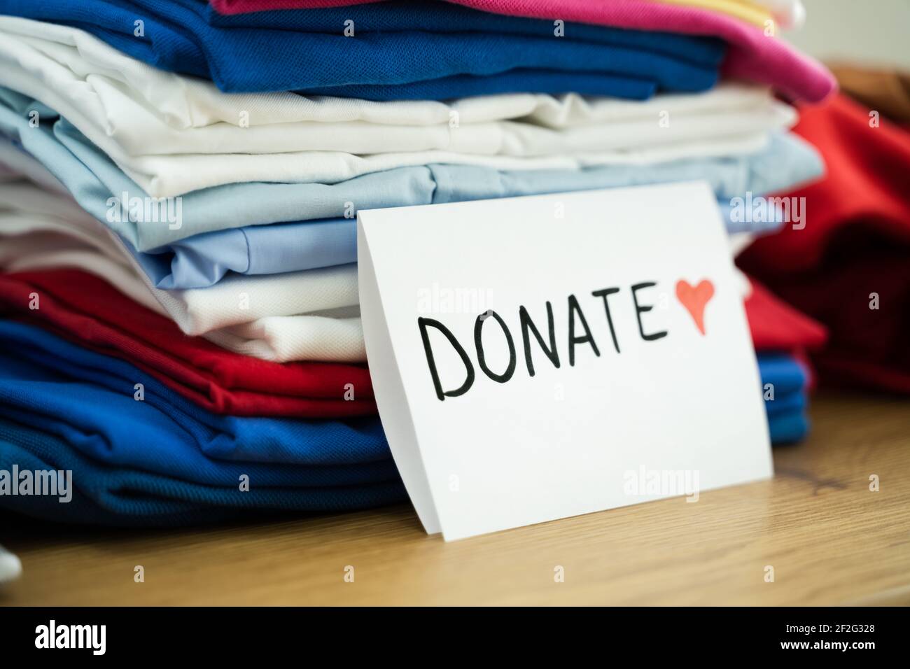 https://c8.alamy.com/comp/2F2G328/clothes-donation-and-social-service-giving-donations-to-poor-2F2G328.jpg