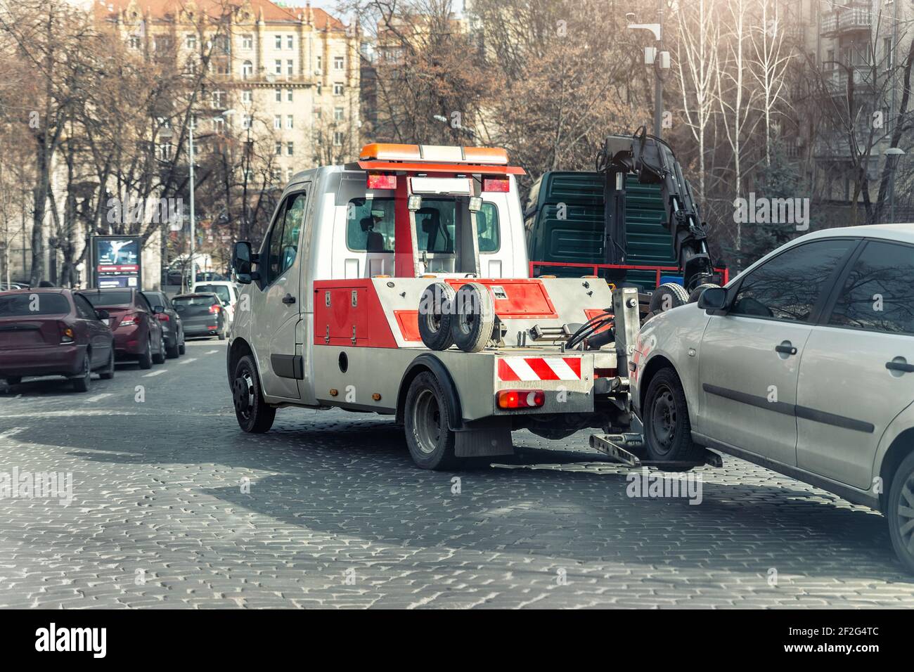 Car evacuation police service by tow truck machine on city downtown