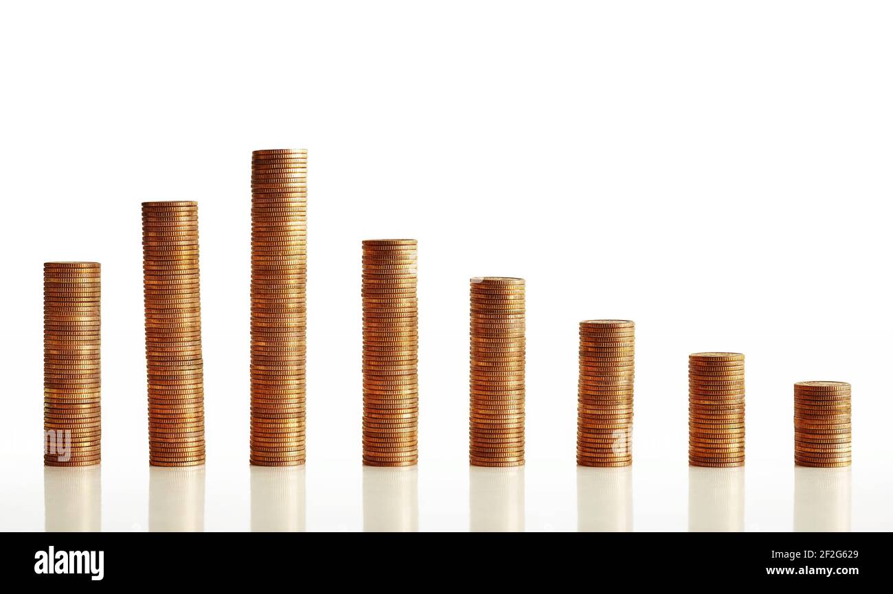 Stacks of old golden coins arranged as a decreasing chart. Stock Photo