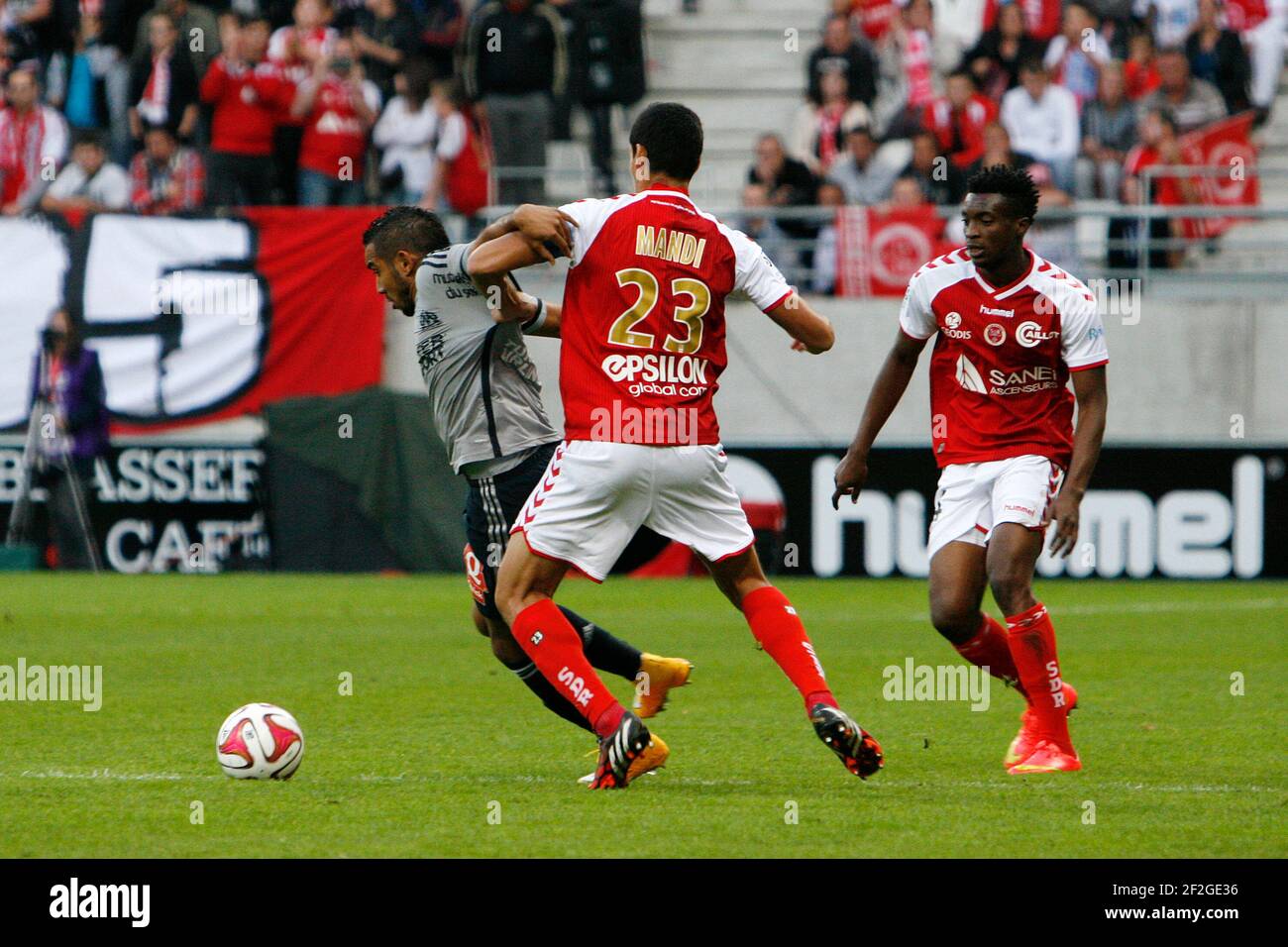 Dimitri Payet of Marseille vies with Aissa MANDI and Benjamin MOUKANDJO of Reims during the French Championship Ligue 1 Football match between Stade de Reims and Olympique de Marseille, on September 23, 2014 at Auguste Delaune Stadium in Reims, France. Photo Anthony Serpe / DPPI Stock Photo