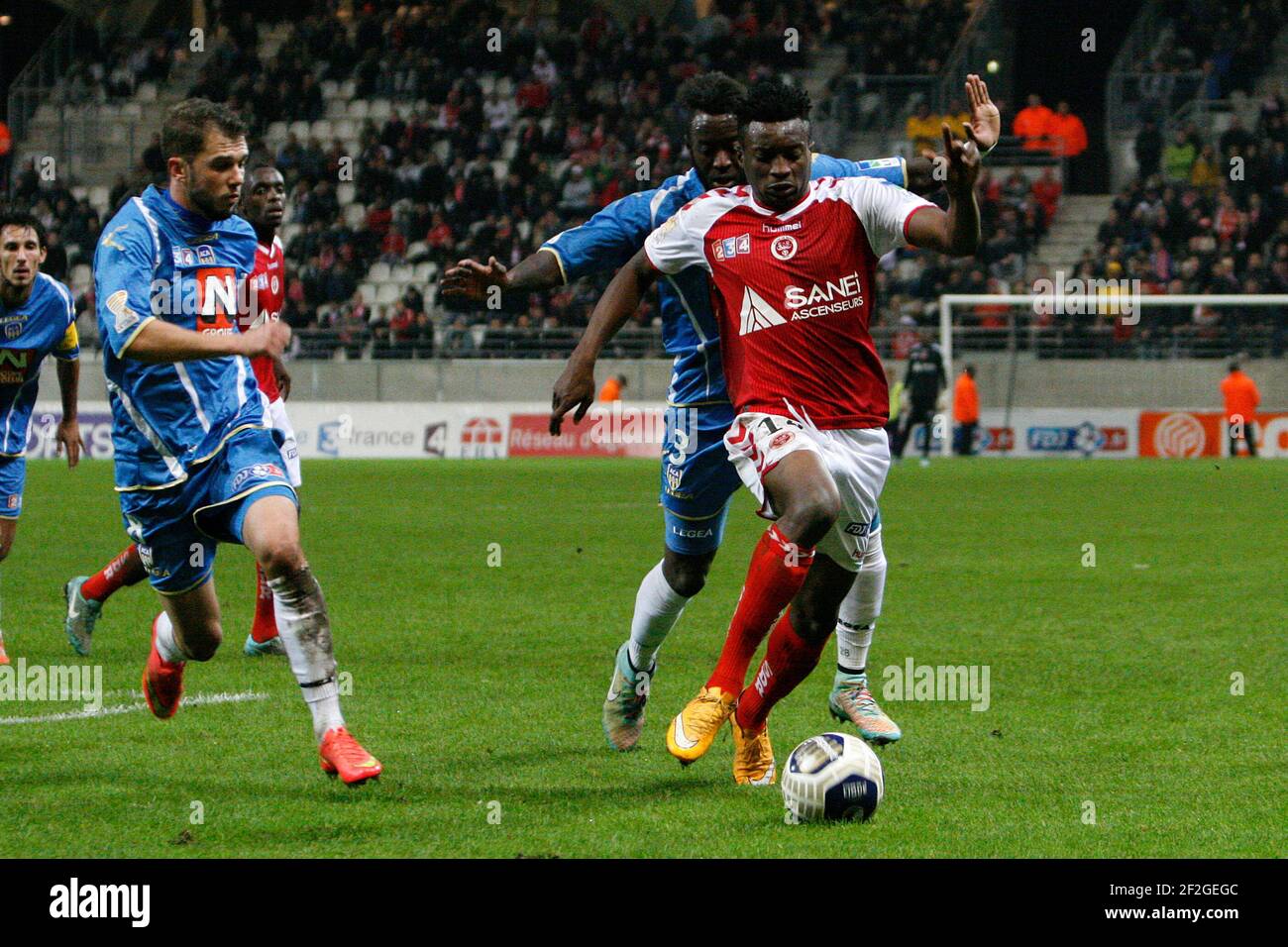 Benjamin MOUKANDJO (14 Reims) and Larsen TOURE (3 Arles) during the 1/16 French League Cup football match between Stade Reims Marne and AC Arles Avignon on october 28, 2014 at Auguste Delaune stadium in Reims, France - Photo Anthony Serpe / DPPI Stock Photo