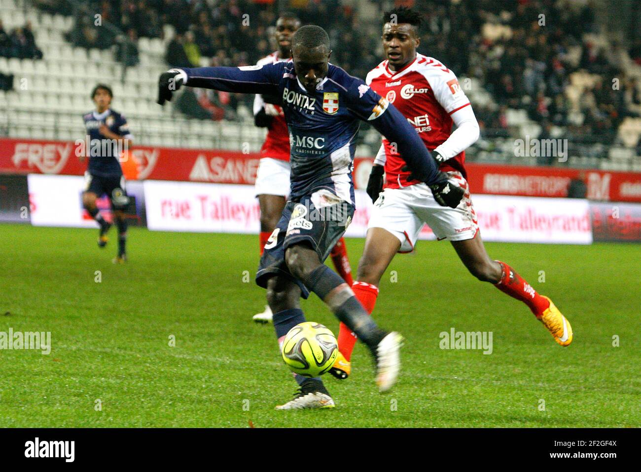 SABALY (ETG) and Benjamin MOUKANDJO (RM) during the L1 french football championship match between Reims Marne and Evian TG at Auguste Delaune stadium in Reims on december 13, 2014 - Photo Anthony Serpe / DPPI Stock Photo