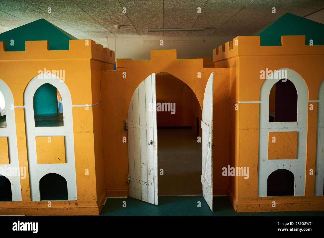 Orange castle playhouse in a school Stock Photo Alamy