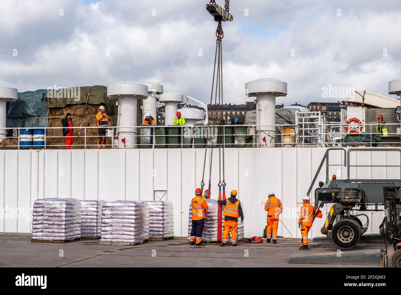 Cork, Ireland. 12th Mar, 2021. The livestock transportation ship 'Finola M' is loaded with feed at Kennedy Quay, Port of Cork, before cattle are loaded tomorrow for export. Credit: AG News/Alamy Live News Stock Photo