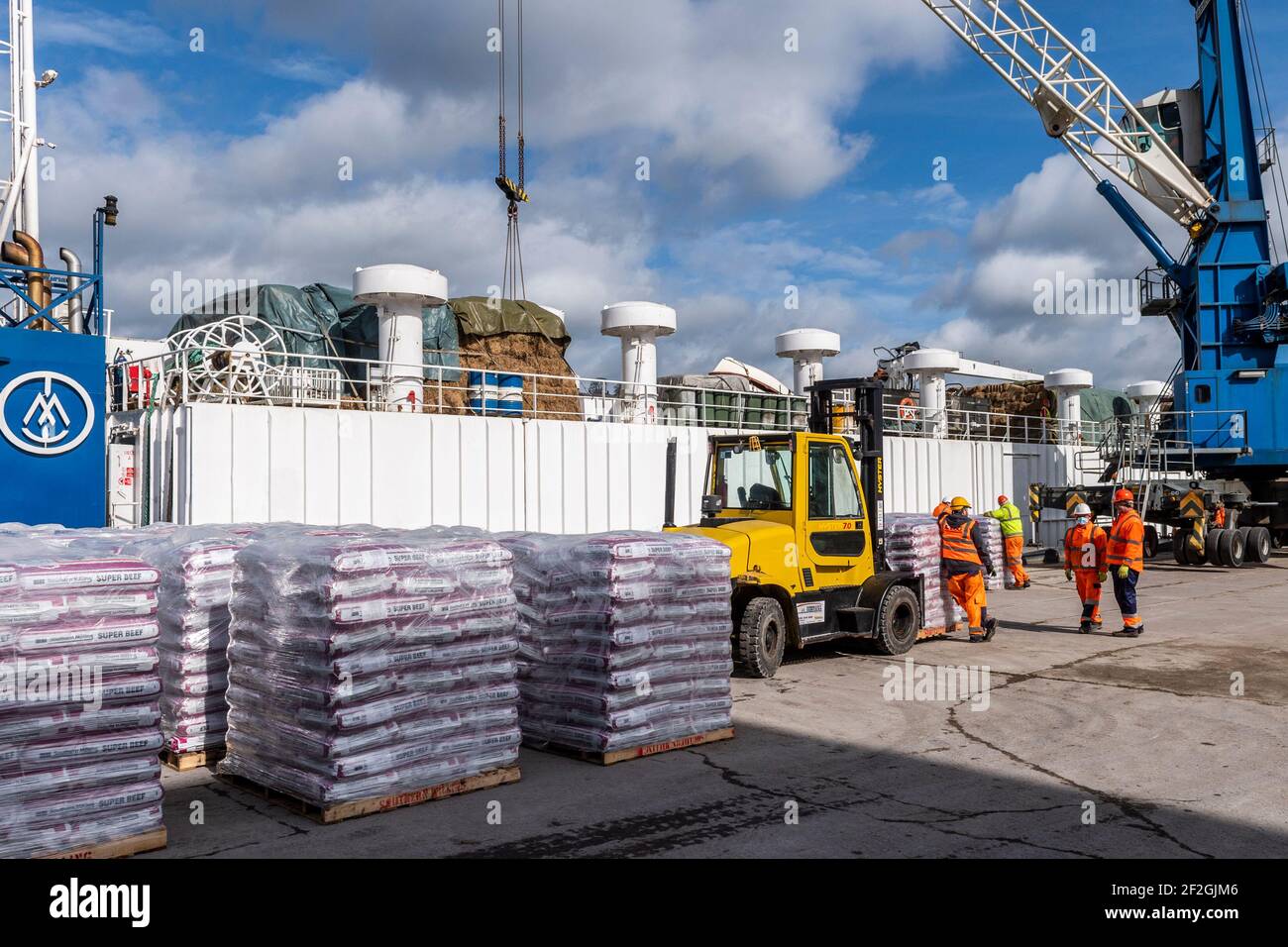 Cork, Ireland. 12th Mar, 2021. The livestock transportation ship 'Finola M' is loaded with feed at Kennedy Quay, Port of Cork, before cattle are loaded tomorrow for export. Credit: AG News/Alamy Live News Stock Photo