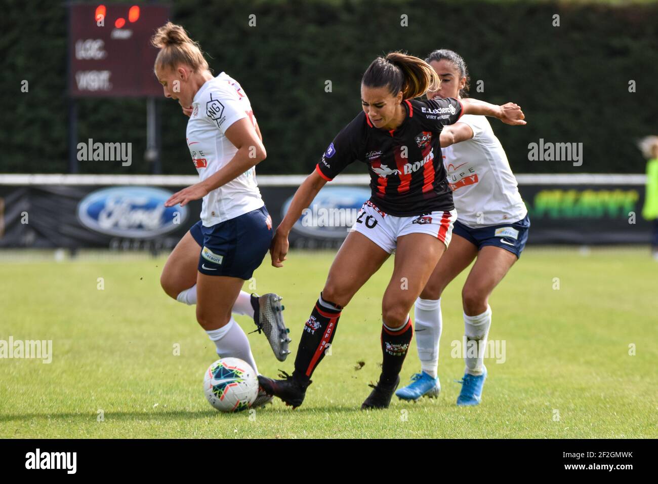 Marie Charlotte Leger of Montpellier Herault Sport Club, Charlotte  Fernandes of FC Fleury and Sakina Karchaoui of Montpellier Herault Sport  Club during the Women's French Championship D1 football match between FC  Fleury
