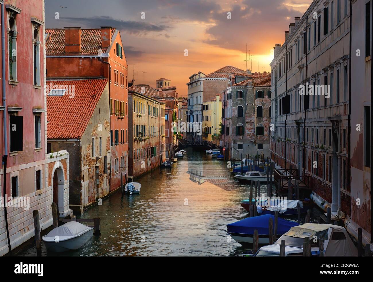 Motorboats and old houses in Venice, Italy Stock Photo