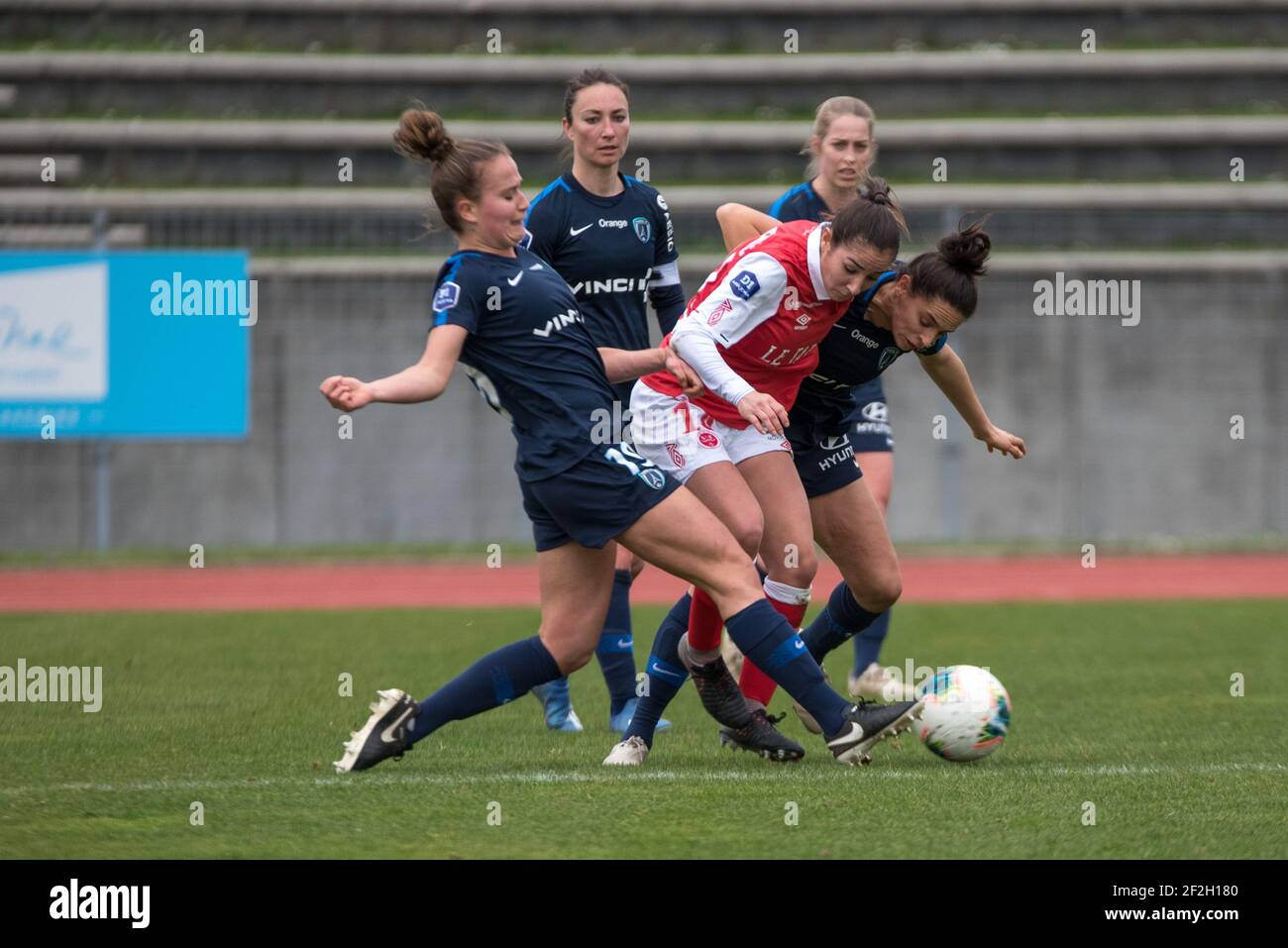 Thea Greboval of Paris FC, Oceane Deslandes of Stade de Reims and Sophie  Vaysse of Paris FC fight for the ball during the Women's French  championship D1 Arkema football match between Paris