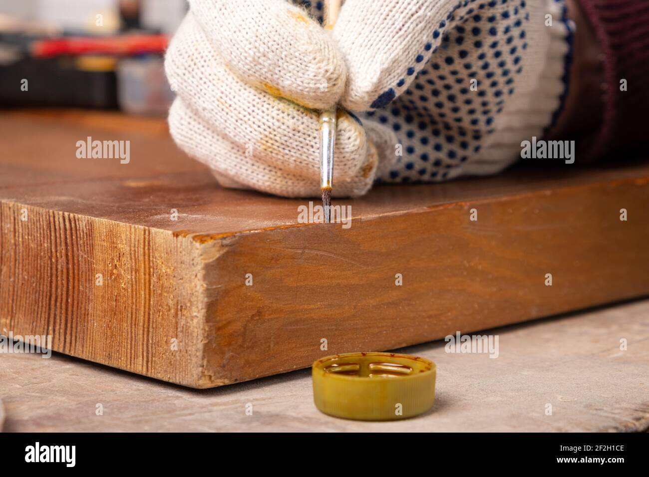 restoration of wooden doors,elimination of chip defects with a paint brush Stock Photo Alamy