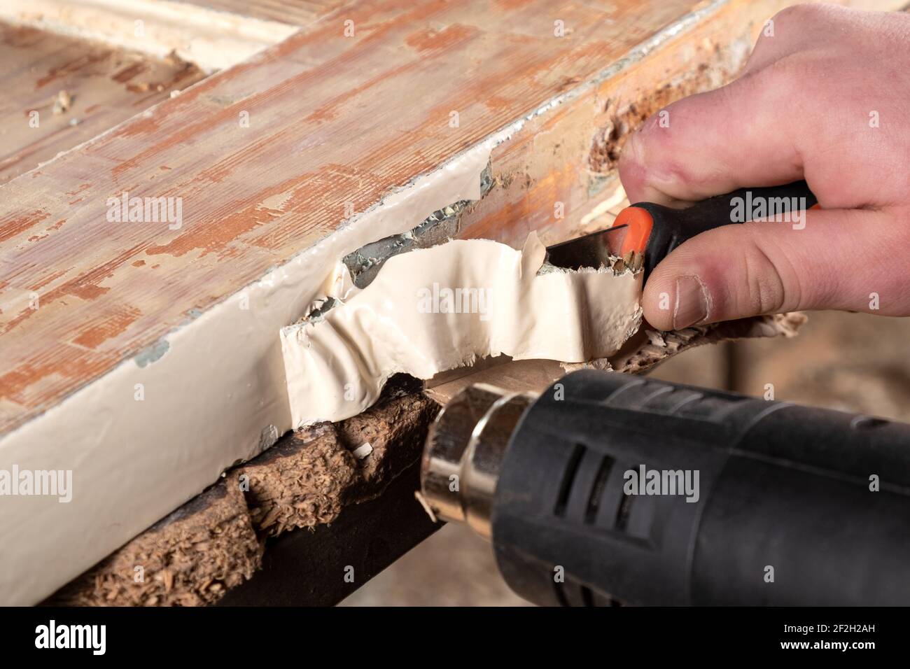 cleaning doors from old paint,restoration of wooden doors Stock Photo