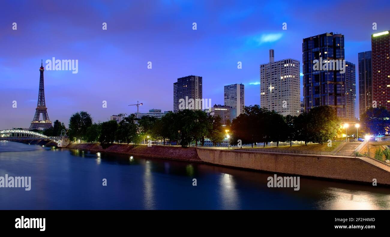Parisian cityscape with the view on Eiffel Tower and skyscapers in early morning, France Stock Photo
