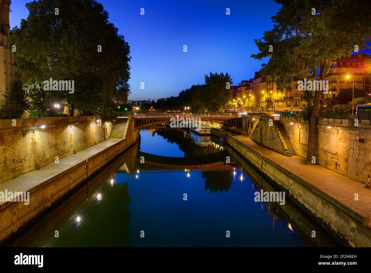 Seine River crossing the city of Paris at midnight Stock Photo
